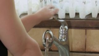 Solo cutie masturbates in the kitchen